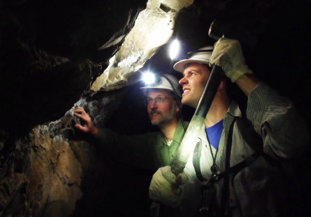 Christoph Heubeck of the Freie Universität in Berlin, Germany, (left) and Martin Homann (right) in an abandoned gold mine near Sheba Mine sampling the lava at the Barberton Greenstone Belt NADJA DRABON, STANFORD UNIVERSITY
